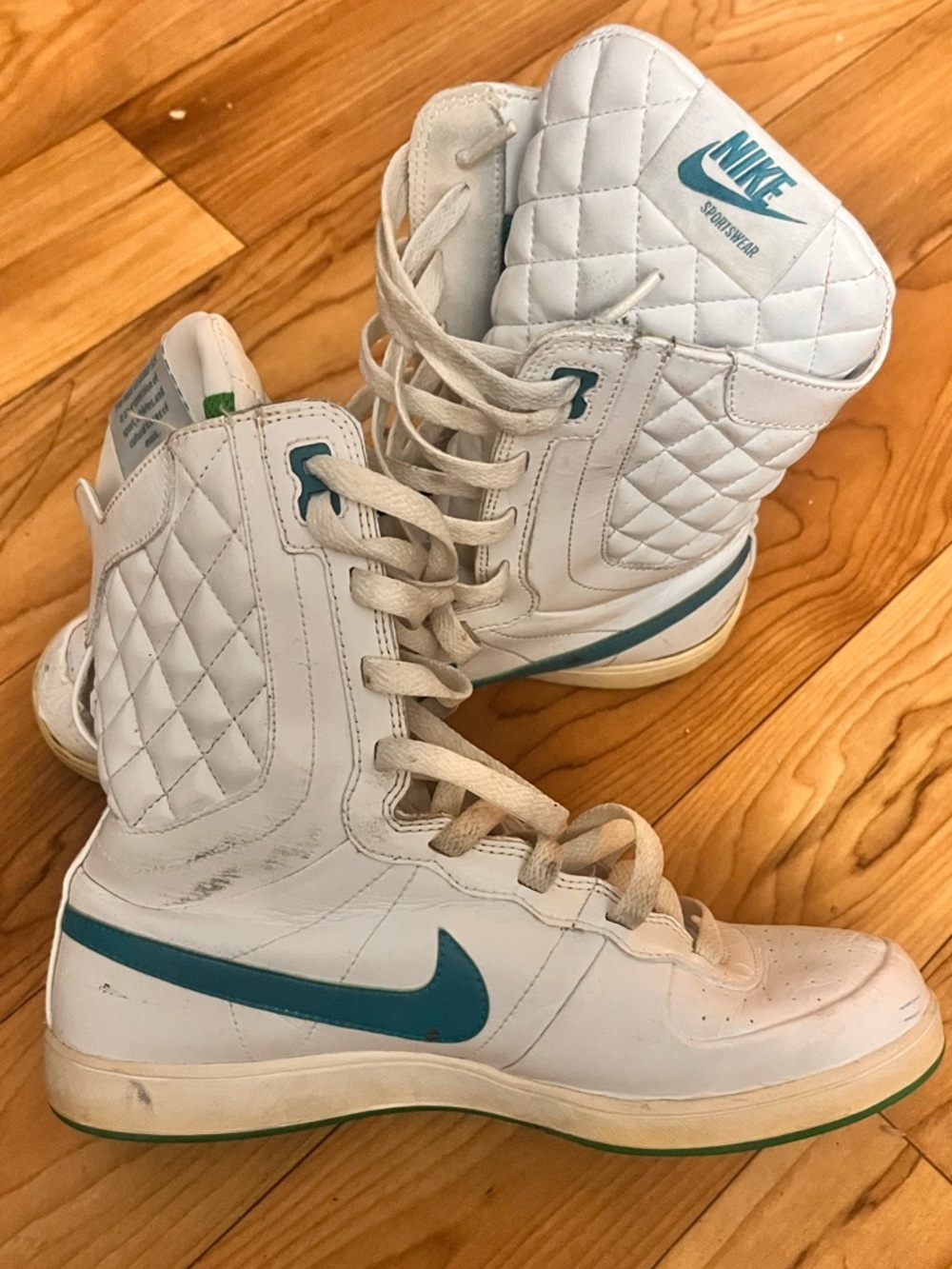 Nike White High-Top Sneakers with Teal Swoosh Accent